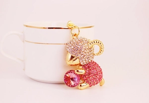 Detail of pink crystal sheep keychain with sparkling rhinestones and gold-plated finish