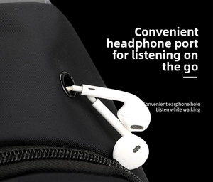 Detailed close-up of the headphone jack feature on a durable black crossbody sling bag