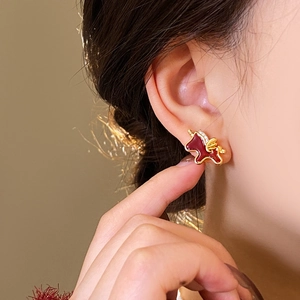Exquisite red enamel horse stud earrings with gold accents and sparkling crystals