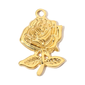 Detail shot of a golden rose-shaped pendant with fine metal textures and leaf motif