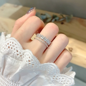 Exquisite silver zircon petal open rings stacked on model with lace cuff detail