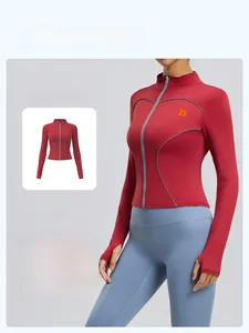 Close-up of a red slim fit yoga jacket with stand collar and reflective stitching