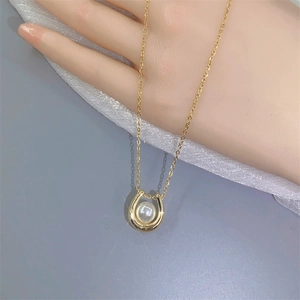 Elegant gold U-shape pendant necklace with white pearl on a delicate link chain