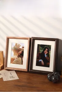 Minimalist photo frame in walnut and coffee wood finishes with elegant white matting