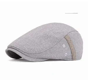 Detail of light gray duckbill hat with woven texture and side metal eyelets