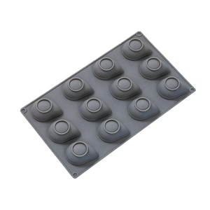 Macro detail of a 12-cavity grey silicone mold for banana mousse and pudding desserts