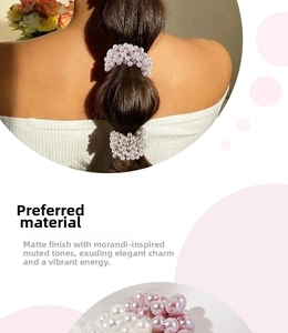 Close-up of pink and white faux pearl hair ties with a soft matte finish and elegant style