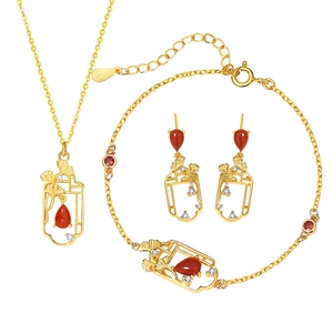 Elegant 925 silver jewelry set with red agate stones and golden ginkgo leaf charms