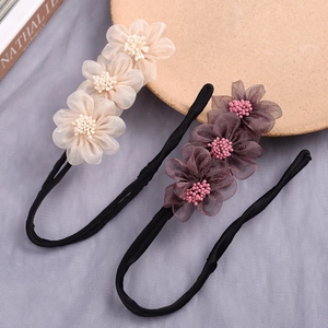 Chic floral bun hair maker with elegant pearl flower petals for easy quick styling.