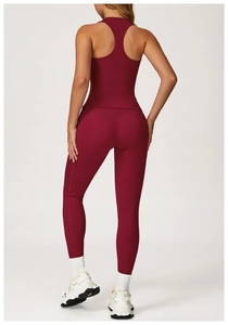 Detail of burgundy racerback yoga top and high-waist leggings showing back fit and texture