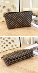 Detailed view of brown clover print handbag with metal zipper and precise stitching
