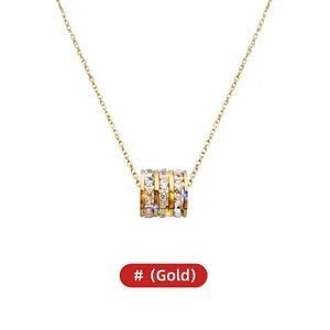 Elegant gold titanium steel necklace featuring a crystal-encrusted cylinder pendant