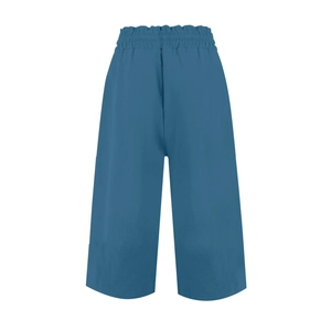 Detailed view of blue linen wide-leg trousers with ruffled elastic high waistband