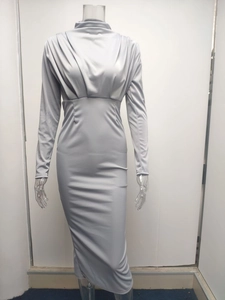 Close-up of elegant pleated detailing on silver-grey slim fit long sleeve dress