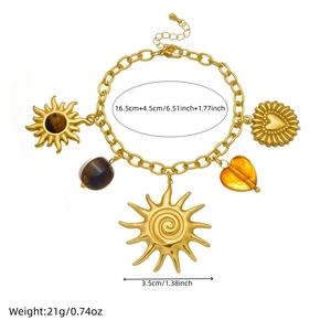 Gold stainless steel bracelet with tiger eye sun and heart charms on a white background