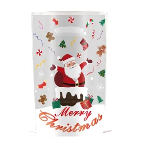 Christmas themed candy gift bag with Santa Claus and festive holiday illustrations
