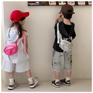 Kids metallic crossbody chest bags in pink and silver with adjustable wide shoulder straps