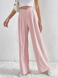 Close-up of the textured pink fabric and high waist design on wide leg casual trousers
