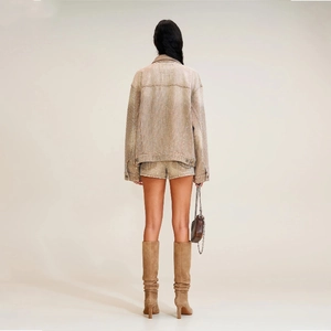 Rear view of tan denim jacket and shorts set with shimmering rhinestone embellishments