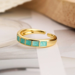 Minimalist gold plated open ring featuring four square green marble textured stones