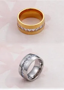Macro detail of gold and silver wide bands featuring square-cut sparkling zircon stones