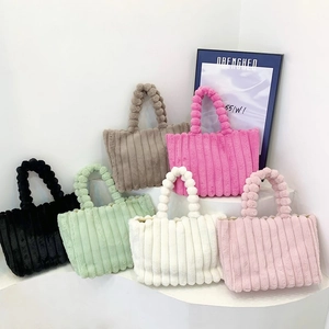 Striped plush tote bags in six colors with unique round ball handles and soft texture