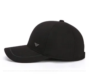 Side view of a black winter baseball cap featuring a silver triangle metal logo and stitching