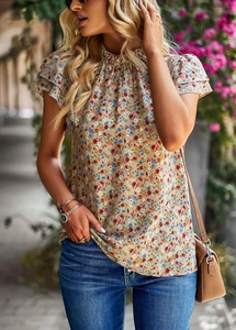 Detail of khaki floral chiffon top with butterfly sleeves and a small high neckline