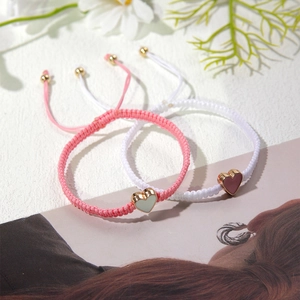 Adjustable heart charm woven bracelets in pink and white styles with metal enamel pendants