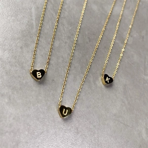 Minimalist gold heart initial pendant necklace with B U K letters in stainless steel