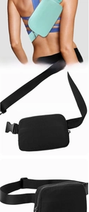Detail of waterproof nylon sports waist bag with adjustable strap and metal zippers