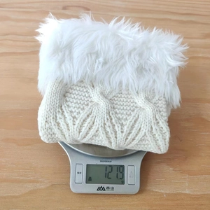Detailed knit texture of a premium Christmas stocking showing thickness and soft faux fur cuff