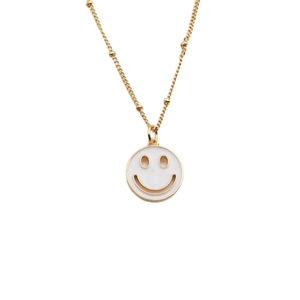 Gold plated beaded necklace featuring a white enamel smiley face pendant with zircon accents