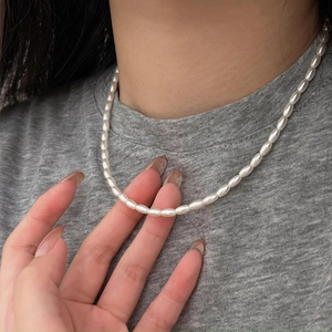 Elegant 925 sterling silver necklace with rice-shaped pearls and high luster finish