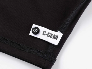 Close-up of side seam stitching and size S label on black modal sports t-shirt