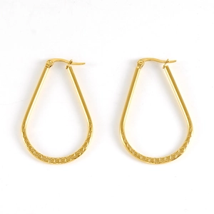 Chic golden oval hoop earrings with textured finish on a clean white background