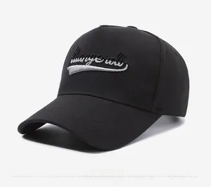 Side view of black 5-panel baseball cap with white 3D letter embroidery and curved brim