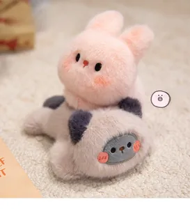 Close-up of soft plush elephant and bunny stuffed animals with fine faux fur texture