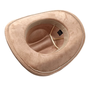 Detail of tan faux suede cowboy hat showing inner sweatband and 100% polyester label