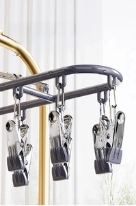 Close-up of waterproof dark gray sock hanger with anti-slip clips and metal hook