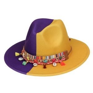 Close-up of wool felt jazz hat featuring shell, starfish, and colorful tassel accents