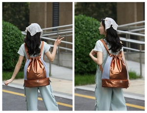 Outdoor lifestyle view of bronze drawstring swim bag with separate bottom shoe compartment