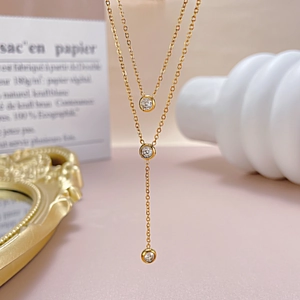 Double layered 18K gold plated stainless steel Y-necklace with three sparkling zircon stones