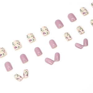 Sweet floral press-on nails with purple freesia flower designs and solid lavender colors