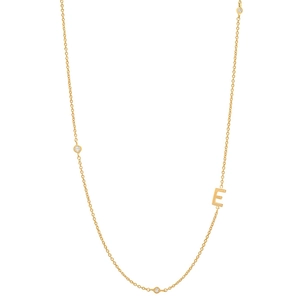 Detail of 18K gold plated letter E necklace featuring sparkling inlaid small crystals