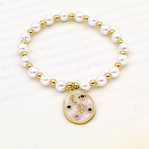 Perlenarmband mit goldenen Perlen und buntem bösem Blick, Stern und Mond Anhänger