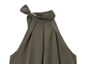 Detail of army green halter top neck with elegant ribbon tie and soft pleated texture