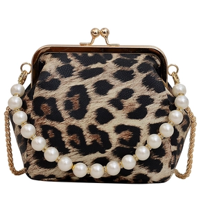 Fashionable leopard print handbag with pearl and gold chain strap on white background