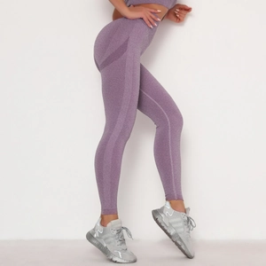 Macro detail of purple seamless high-waist yoga pants with supportive ribbed textures