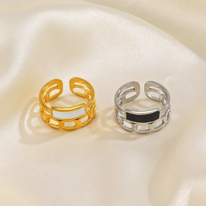 Adjustable open chain rings in gold with white enamel and silver with black enamel